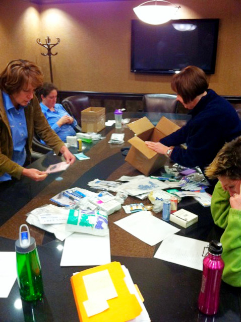 Bags are being packed with critical dental supplies, scrubs, 