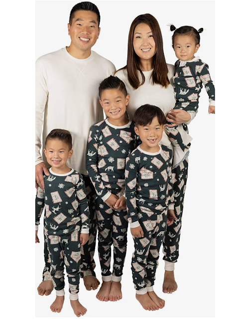 Family wearing matching christmas pjs with letters to Santa on them.
