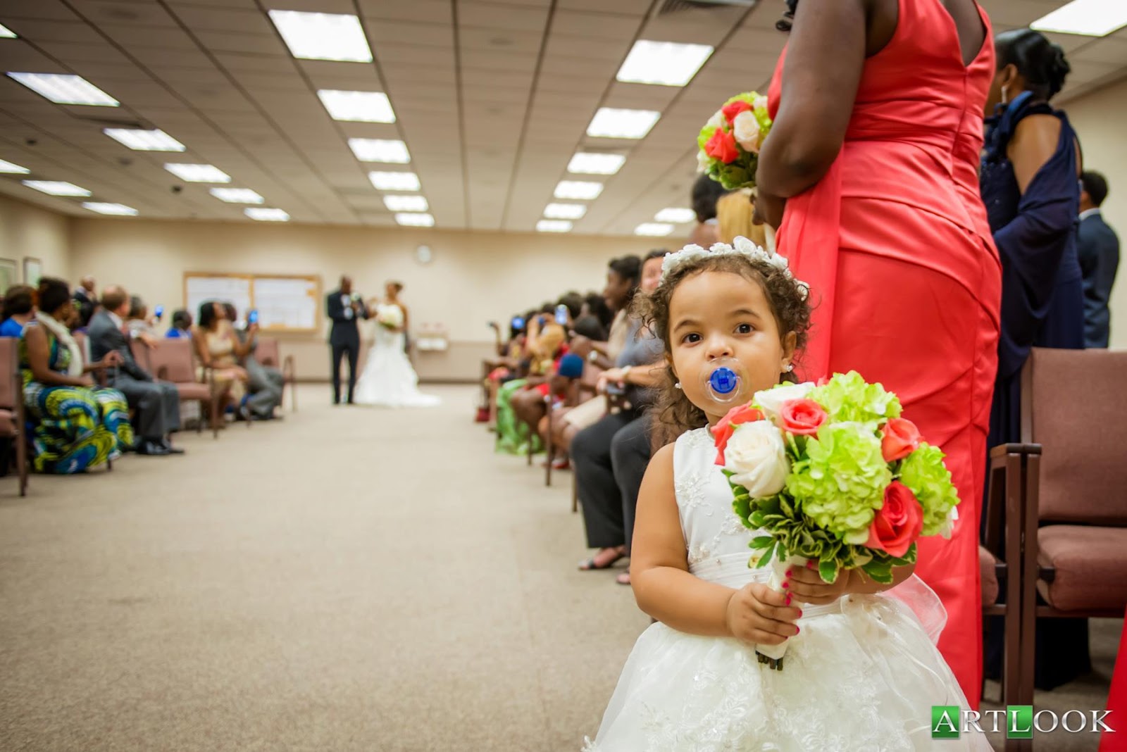 Little kid enjoying every aspect of a unique wedding ceremony.