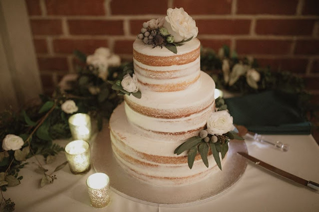 wedding cake with dark foliage