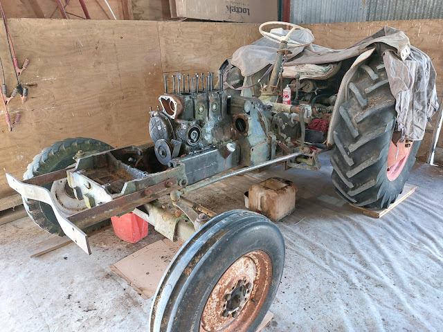 Engine being stripped for removal for tractor's electric conversion