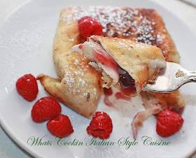 these are a fried flour tortilla filled with raspberry filling or pie filling or your choice with rasberries on top. Sprinkled with powdered sugar and on a elegant plate to serve guests