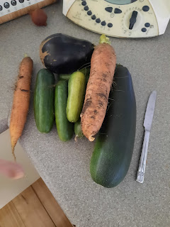 Assorted vegetables next to a butter knife