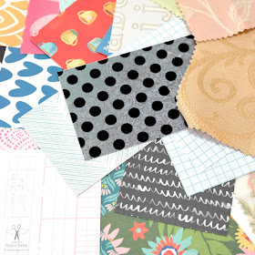 Patterned Paper and Fabric Scraps Cut to Size for a Mini Album