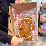 A gingerbread wreath attachment and decorative picks ready to ship.