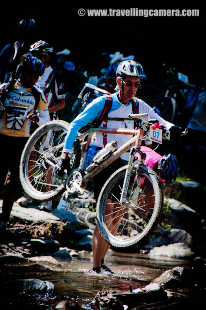 Bike Riding Activities during 8 days of Mountain Terrain Biking event of Himachal Pradesh 2010 : Posted by VJ SHARMA on www.travellingcamera.com :Its been more than 3 weeks that I am posting Photographs of Mountain Terrain Biking in Himachal Pradesh (2010) and today I thought of sharing photographs of Riders only... Please check the Photographers of most of the riders who participated in MTB Himachal 2010...Some of them are in silhouettes to make that snow covered hills are noticeable in the photographs....Riders on highest speed during downhill stretch of MTB Himachal 2010...Bhago Bhago.... MTB Riders aa rahe hain... A Call by one of the Photographer to others standing on next turns of the same road...Here comes Rider Number 41 of MTB Himachal 2010... Who is he?All the riders were very skillful and had to cross many challenges on the way... Roads, Traffic, Weather etc...Flying Riders of Mountain Terrain Biking event of Himachal Pradesh (2010)Mr Ranjan Nautiyal in Downhill during third day of MTB Himachal 2010....One of the rider from Banglore who were sponsored by Royal Challenge...Here comes another passionate rider of MTB Himachal 2010.. He was from Maharashtra Police and had participated in Common Wealth Games 2010 in Delhi...A Passionate rider from Dehradun.. Mr. Ranjan Nautiyal !!!Dutta Ji !!! Another Rider of MTB Himachal 2010 - with his unique style... He never wear shoes and most of the time rode the bike bare feet... Dutta Ji is a farmer in Maharshtra state of India....Delhite Rider @ MTB Himachal 2010 ... a Nepali Rider talking to air in Himalayas @ MTB Himachal 2010 !!!Me standing with Nepali Team @ Jalori Pass, in front of Banjar mountain range which was covered of snow...Riders in the beginning of fifth day after a good stay at Kullu Sarahan Village @ 3200 meters...One of the rider starting from Kullu Sarahan Camp on Fifth day of MTB Himachal 2010 !!Mr Suresh, A rider from Maharashtra cleaning his bike during rest day @ Kullu Sarahan Village...Rider no 2, I think he is Rohitash from Banglore :)MTB Himachal riders repairing their bikes @ Baghipul...Riders struggling to ride during hike & bike session on second day !!!Riders dragging their bikes in hiking stretch on second day of MTB Himachal 2010...Another Rider dragging his bike on second day of Mountain Terrain Biking @ Himachal PradeshMTB rider crossing the natural obstacles... on second day of Mountain Terrain Biking event in Himachal Pradesh....Unique style of riding the bike on straight hill on second day of MTB Himachal 2010....Riders during Hike and Bilke Stretch on second day after camping @ Shainj Village in Shimla District..Every rider had to cross a river on second day of MTB Himachal 2010... But here is one enthusiast who is having fun inside the river with chilling water...Another rider crossing the river during second day of Mountain Terrain Biking in Himachal Pradesh.. 2010He also wanted to save his shoes from water :)MTb Rider about to hit the final line...Another MTB rider struggling hard to reach the final line...MTB RIDERS crossing water stream on the way...Riders crossing through various villages on the way ....Rains had added more excitement among riders..Uphill Stretch during first day of Mountain Terrain Biking in Himachal Pradesh... 2010Its evening time now... and next destination is still far away....