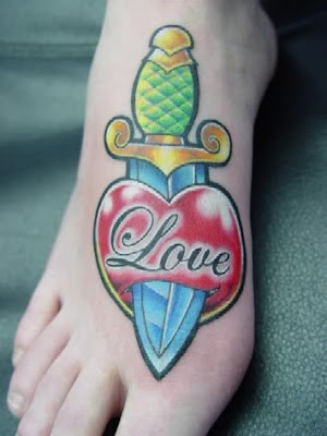 Heart and dagger foot tattoo for guys