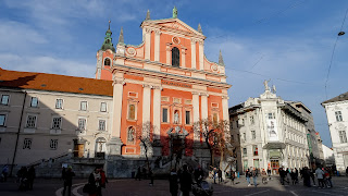 Prešeren Square has an orange building