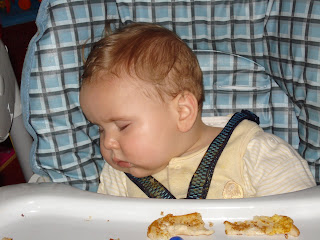 Baby Boy asleep in the High Chair