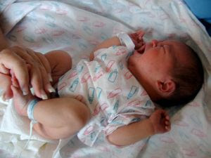 Baby's first diaper change. Stock Photo Credit: Carin