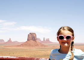 Tessa at Monument Valley Navajo Tribal Park. The landscape looks a bit hazy in the background due to a whole lot of blowing dust!