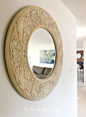 Decorative framed mirror painted yellow.