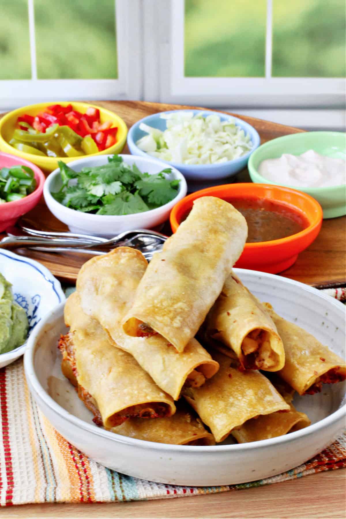 Crispy Baked Chicken Taquitos in a bowl.