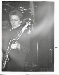 Bruce Foxton on stage at the Roxy in London in 1977 by Adrian Fox