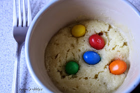 A gluten free mug cookie with m&ms from Anyonita Nibbles