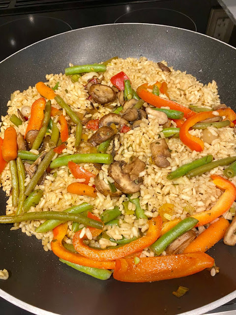 mushroom vegetable risotto in a skillet