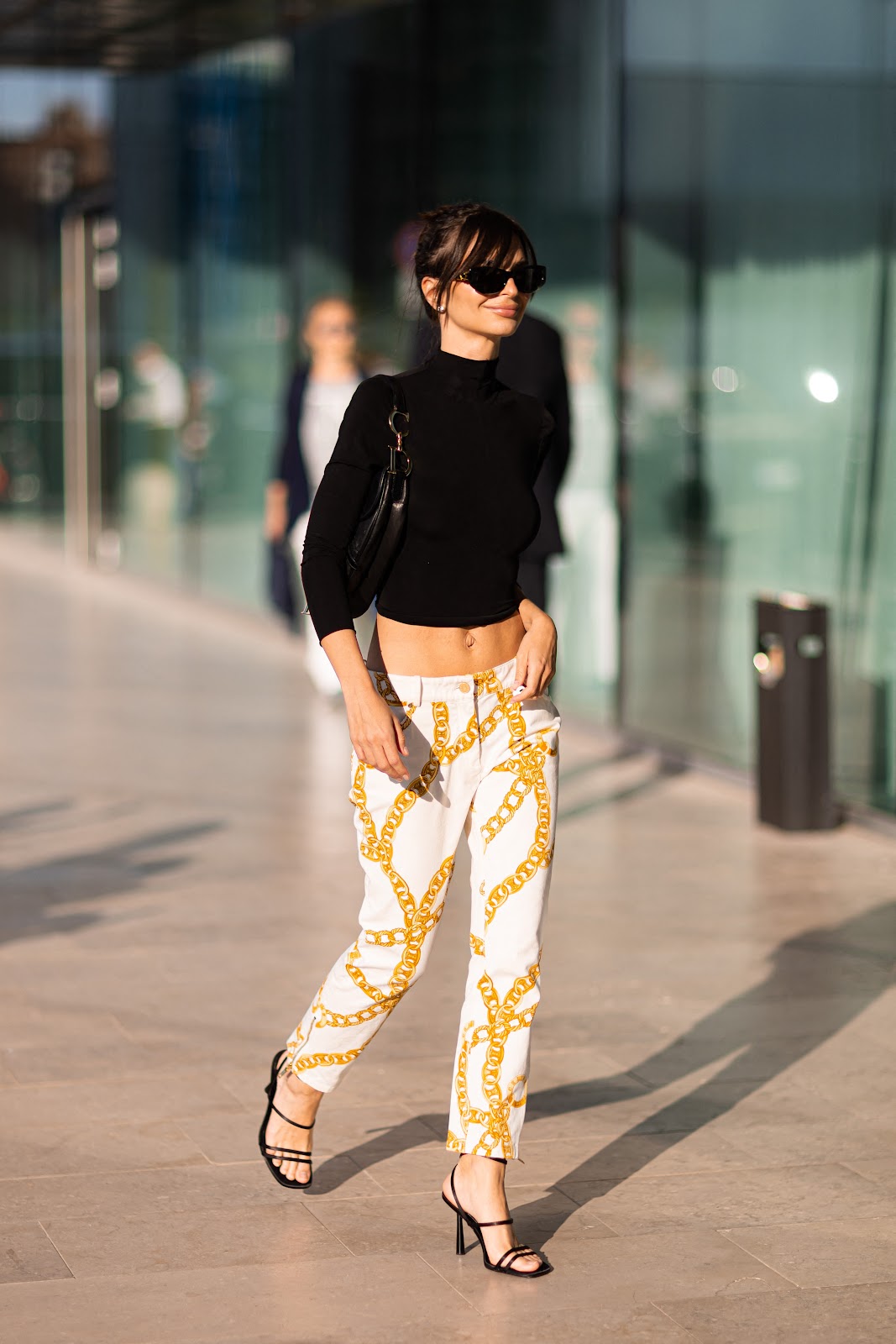 Emily Ratajkowski Subtly Exposes Her Thong Straps with Low Slung Printed Pants