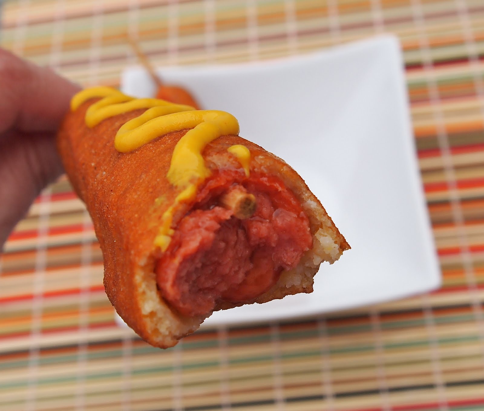 Roll hot dogs in batter until well coated and fry 2 or three at a time ...