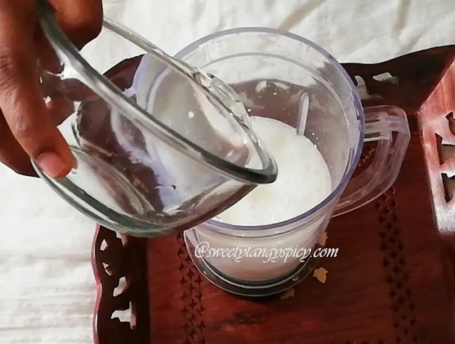 "Pouring one cup of water (or milk) into the mixer juice jar with thick yogurt."