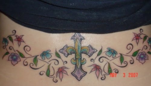 Lower Back Tattoo with Cross and Flowers