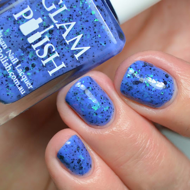 blue nail polish with color shifting flakies three finger swatch