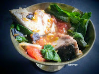 Boiled fish cooked with greens