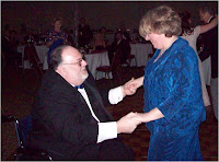 Charlie Pinson, Kentucky insurance agent, dances from wheelchair with wife, Joyce