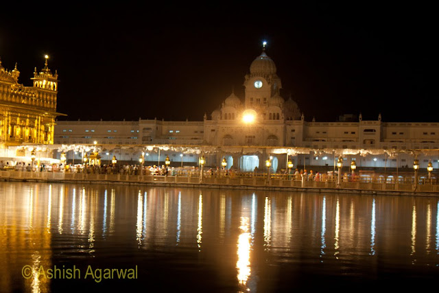 View of the Harmandir Sahib and the causeway with devotees inside the Golden Temple