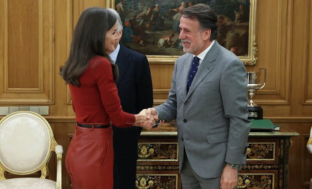 Queen Letizia wore a red frankie cuff detail wool sweater by Hugo Boss, and red leather trousers by Hugo Boss