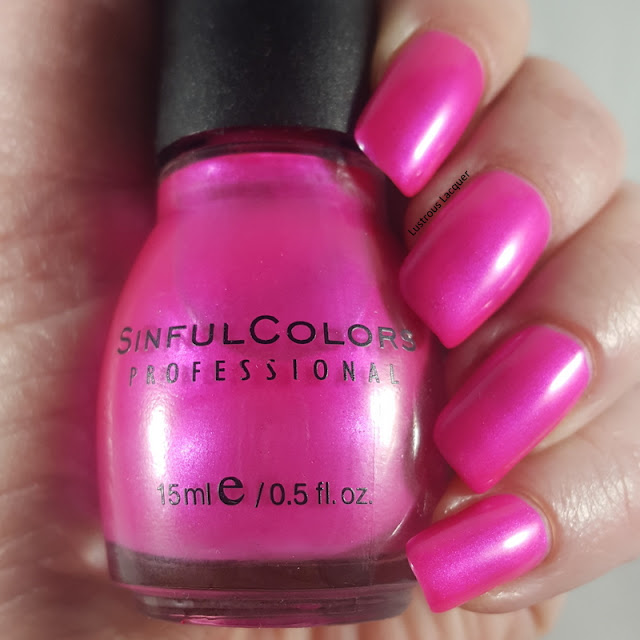 Bright pink nail polish with iridescent shimmer