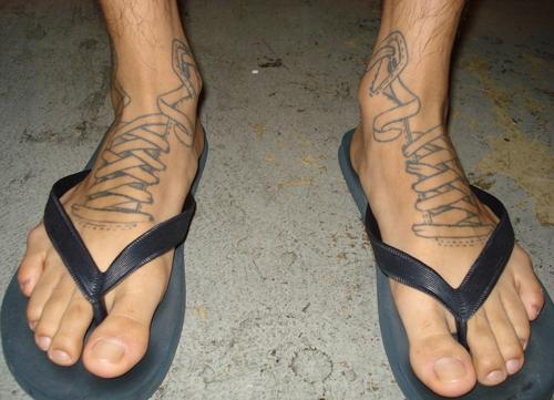 Sneaker foot tattoo for men.