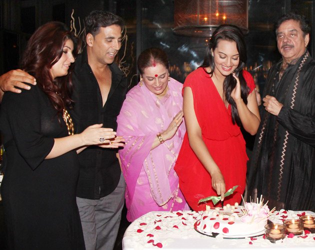 Sonakshi sinha in a gorgeous red dress cutting cake -  Sonakshi Sinha celebrates her birthday with Akshay and Prabhudeva