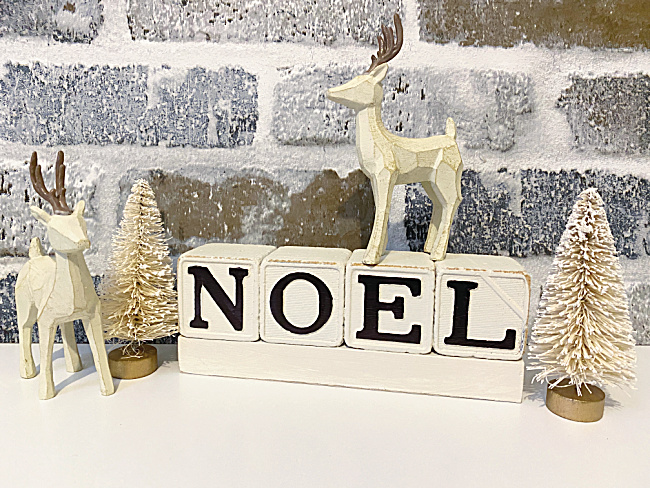 block sign, trees and reindeer