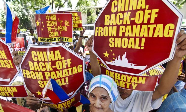 Filipinos protest in Manila stage demanding China pull out of the contested Scarborough Shoal in the South China Sea. Photograph: Dondi Tawatao/Getty Images