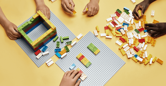 Children using LEGO Braille Bricks to read and to build with.