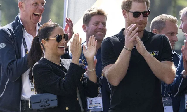 Meghan Markle wore a new chasseur boucle tweed jacket by Celine, and carries new chain shoulder bag by Celine