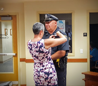 Patrolman Paul Fiorio gets badge #1 as the longest serving officer