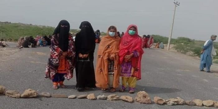 Women Protesting By Blocking the Road