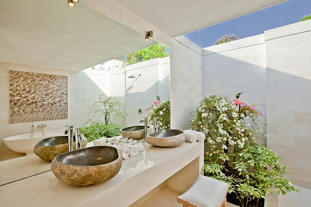 Picture of stone sinks in the modern tropical bathroom