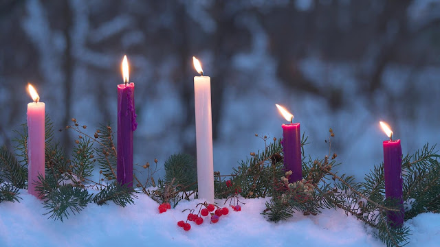 Advent candles in snow