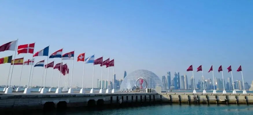 Doha Corniche is decorated with the flags of the countries participating in the 2022 World Cup (Getty).