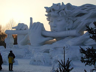 Snow Sculpture of Girl with a flute at Sapporo Snow Festival