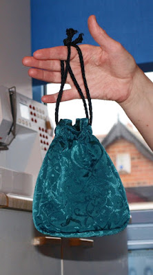 Drawstring evening bag