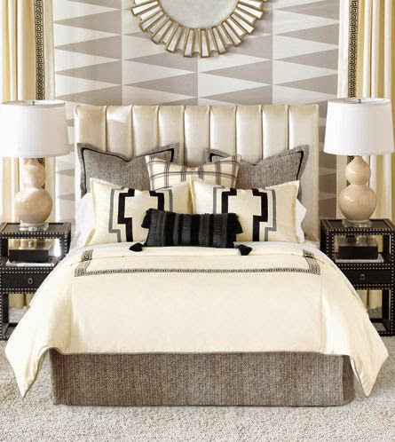 neutral master bedroom with showcase wall in geometric pattern