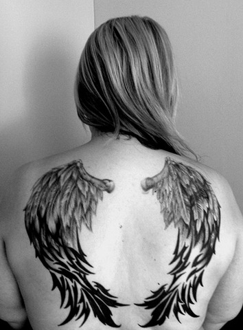 The edges of the Wings have a disheveled look to them Tattoos body and the