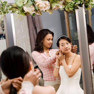 Mother of the bride; bride preparing for her wedding
