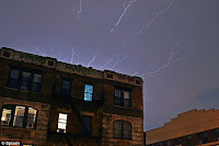 A huge lightning attach strikes Statue of Liberty for a moment