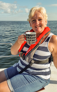 Photo of me enjoying a cup of tea at sea