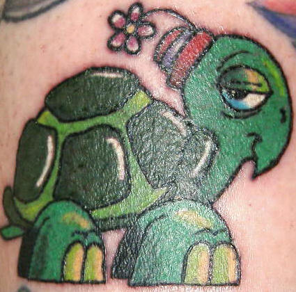 Cartoon turtle with flower tattoo.