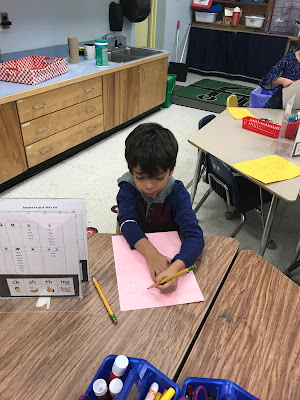 A boy making a card